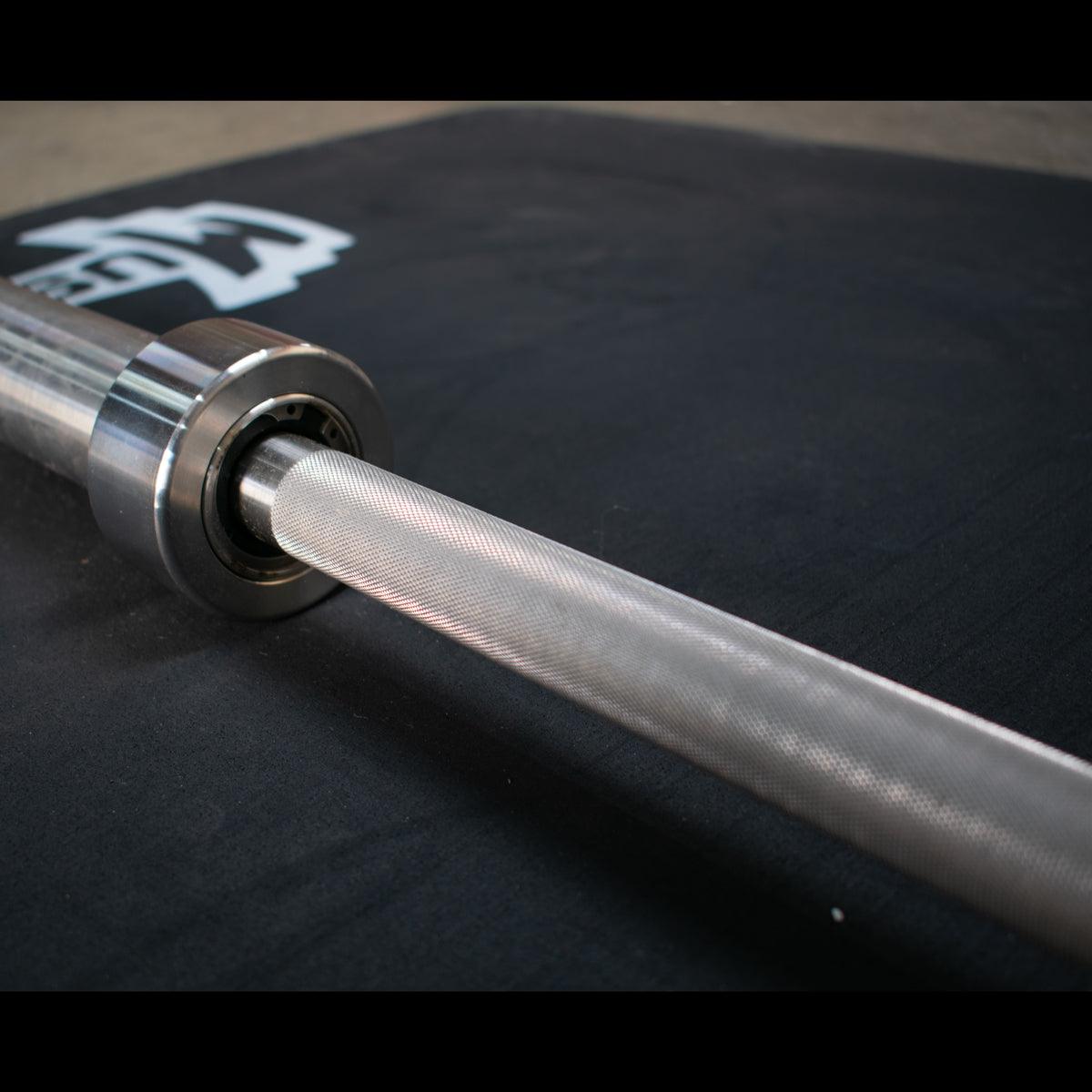 7' Stainless Steel Olympic Bar - Bushing - Muscle D Fitness - Quality Knurling - Grit Grind Strength