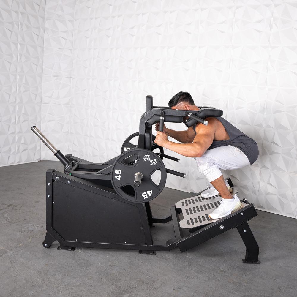 Excel Glute Line Hack Squat / Front Squat - Muscle D Fitness - Plate Load Squat Machine - Counter Balanced - Plate Storage Pegs - Grit Grind Strength