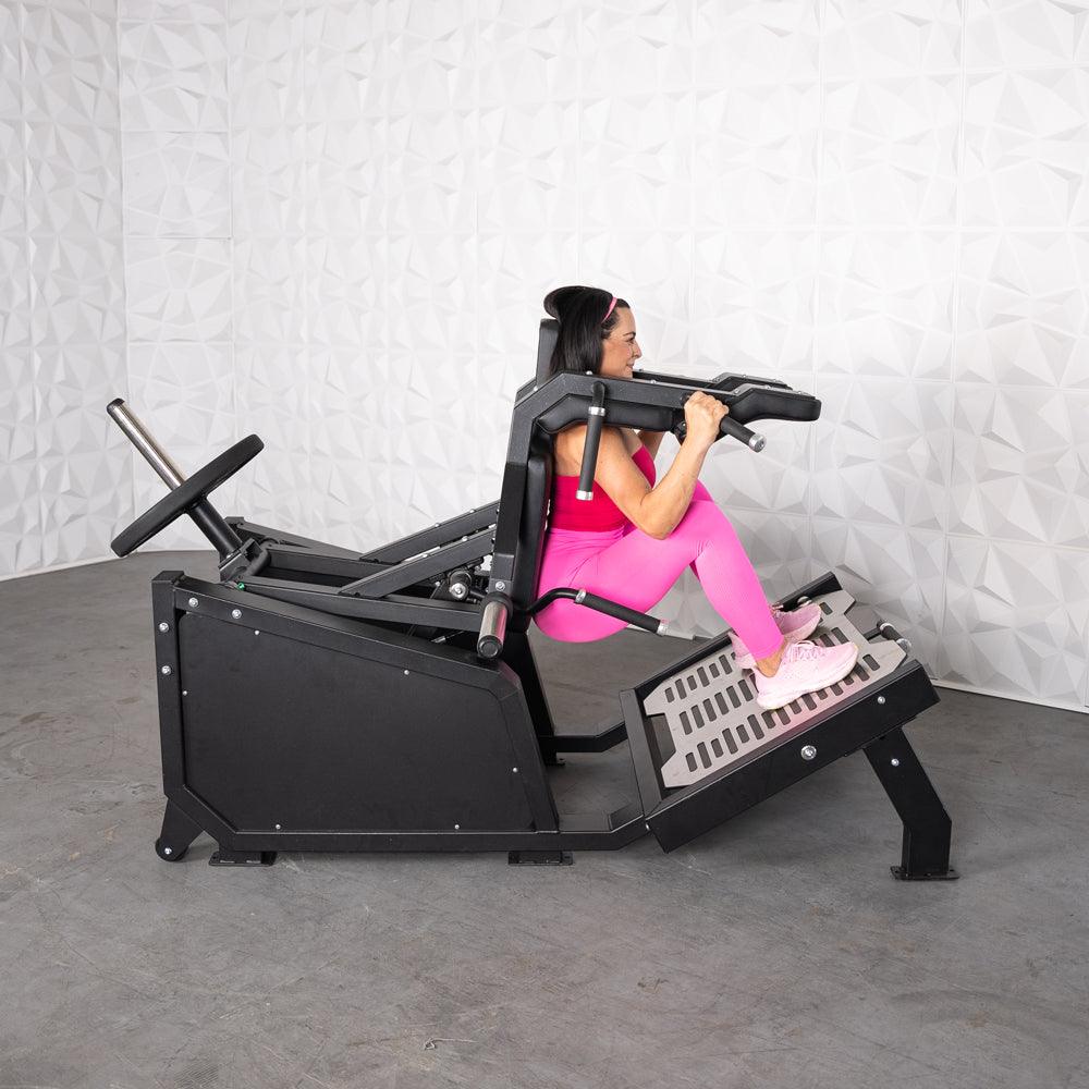 Excel Glute Line Hack Squat / Front Squat - Muscle D Fitness - Plate Load Squat Machine - Counter Balanced - Plate Storage Pegs - Grit Grind Strength