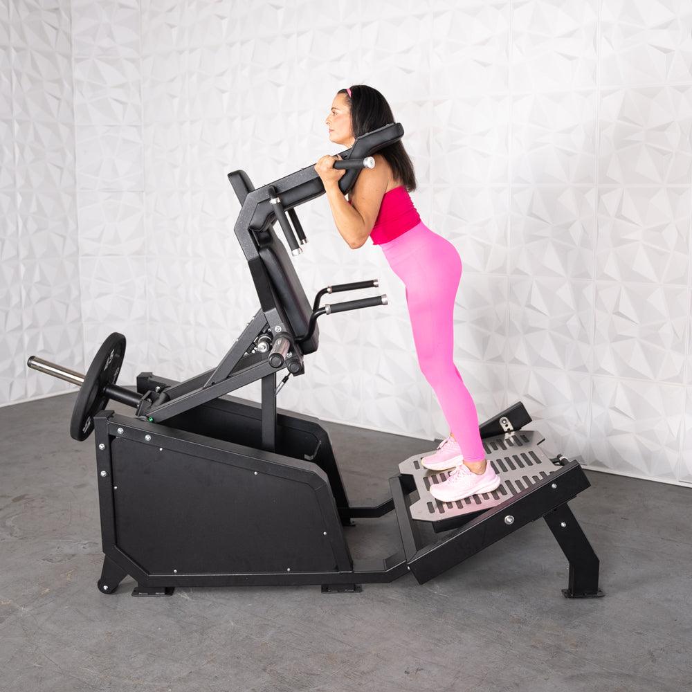 Excel Glute Line Hack Squat / Front Squat - Muscle D Fitness - Plate Load Squat Machine - Counter Balanced - Plate Storage Pegs - Grit Grind Strength