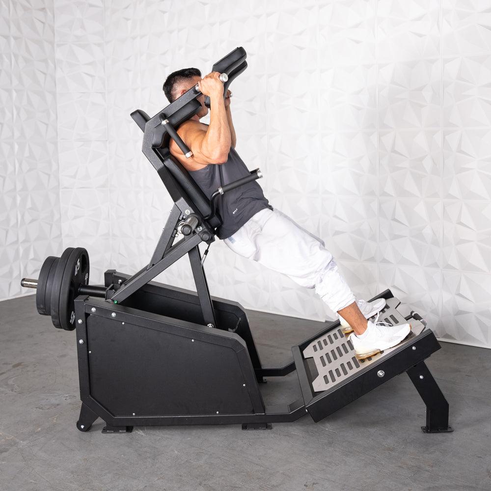 Excel Glute Line Hack Squat / Front Squat - Muscle D Fitness - Plate Load Squat Machine - Counter Balanced - Plate Storage Pegs - Grit Grind Strength